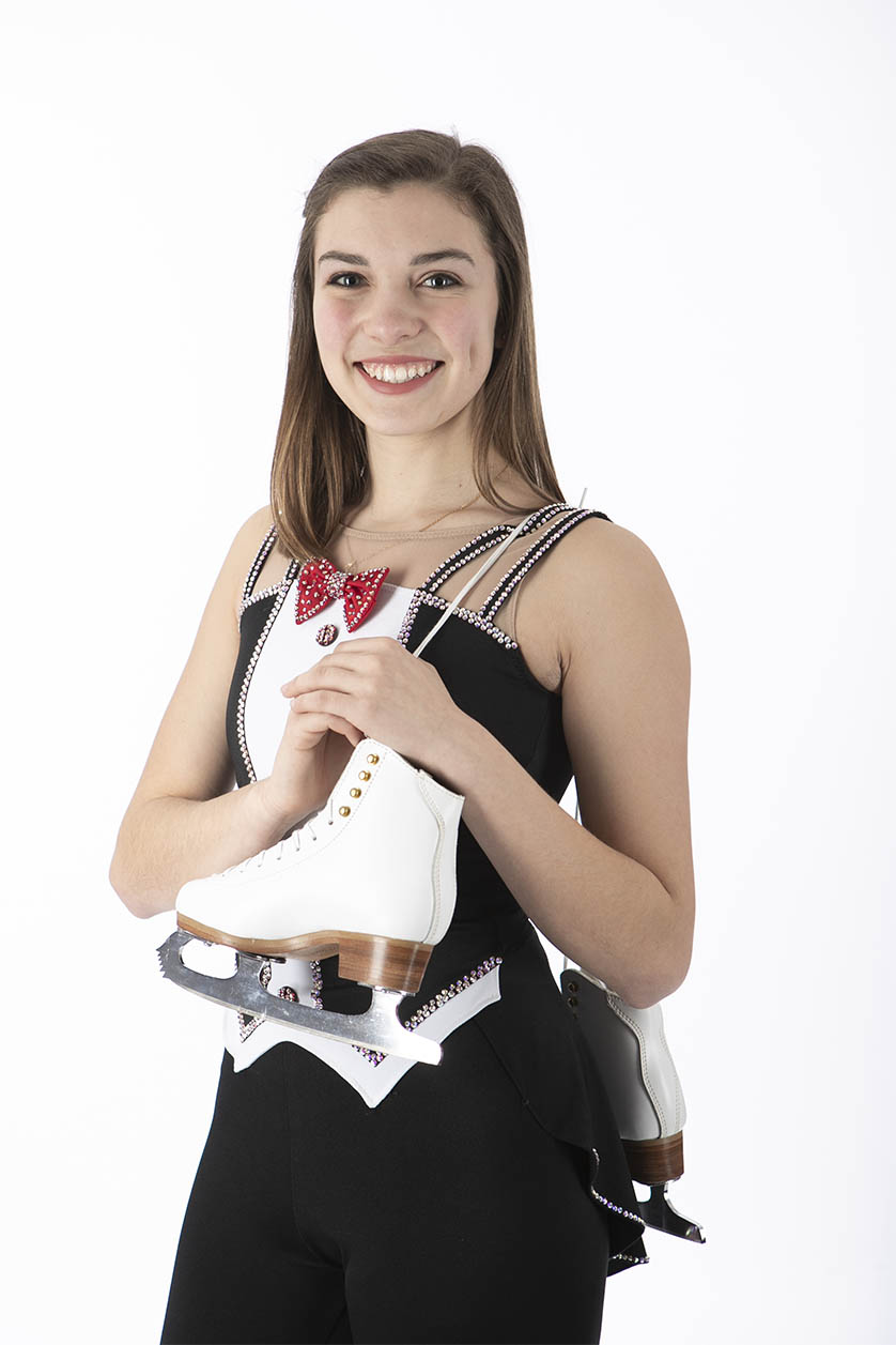 Figure skater with skates on white seemless background.